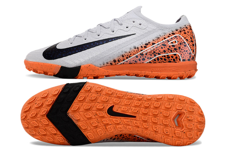 Chuteira Infantil Society Nike Air Zoom Mercurial Vapor 16 Elite TF Branca, Laranja e Preto "Eletric Pack"