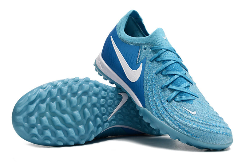 Chuteira Infantil Society Nike Phantom GX 2 Elite TF Azul "Mad Ambition Pack"